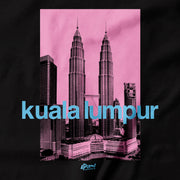 The Petronas Twin Towers once stood as the tallest towers in the world. Stand tall with this KLCC street tee. If you want to bring home a piece of Malaysia this is a must have souvenir. Close Up of the silkscreen print. Pink on black. Of malaysia’s tallest building! By Apom!
